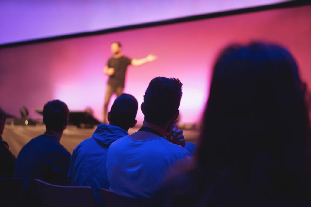 Person presenting to an audience